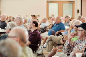 Bagel boys listening to a speaker