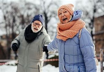 A man and woman dressed warmly to be outside in the winter.